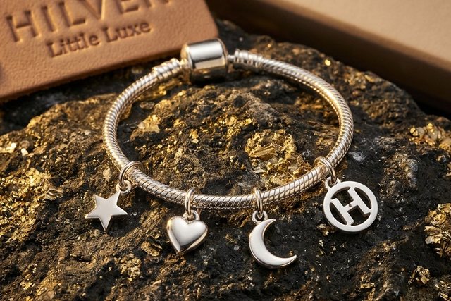 A Hilver silver charm bracelet with star, heart and moon charms