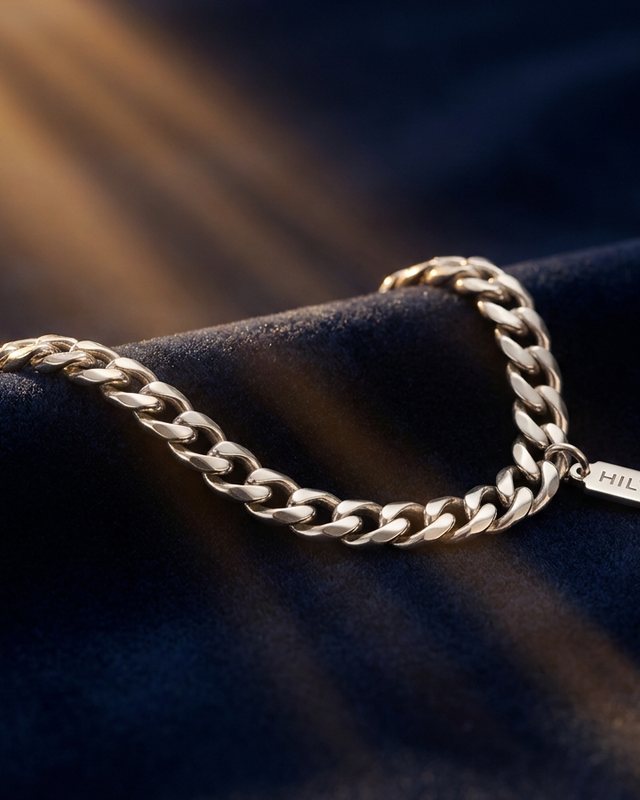 Silver curb chain on navy velvet, from the Signature Shine tier